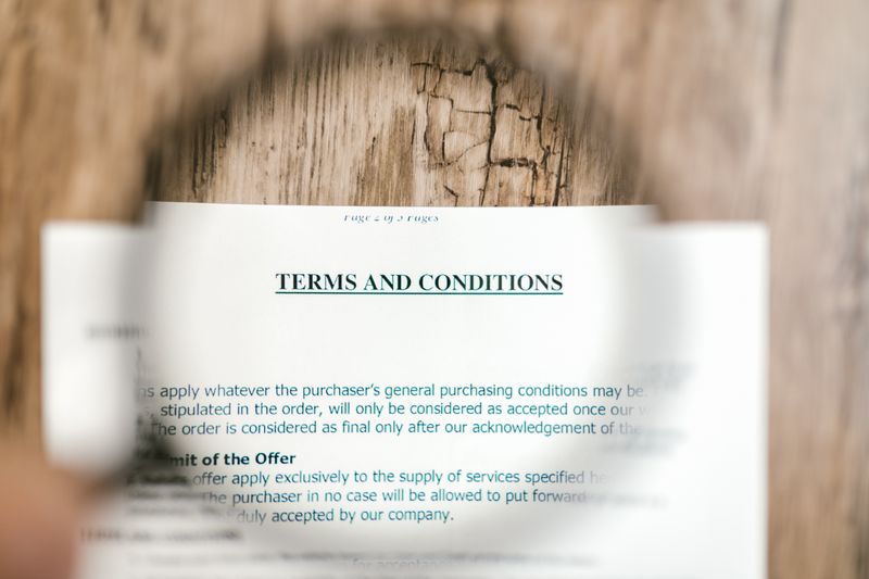 Document with magnifying glass representing regulatory compliance and standards
